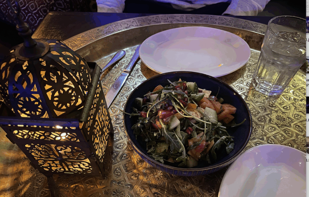 fatoush salad next to a lantern