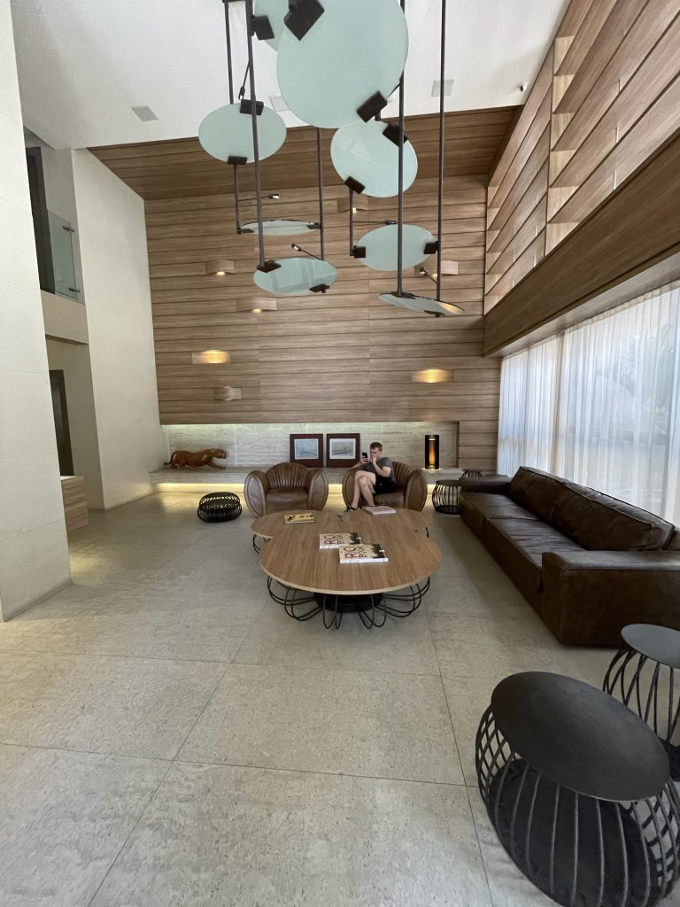 Hotel lobby with horizontal wood panels and trendy light fixtures in Rio de Janeiro