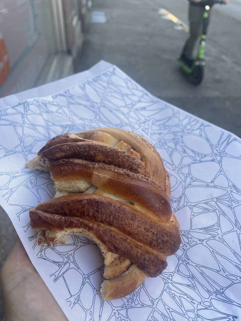 Half Eaten Cinnamon Bun on paper in Norway