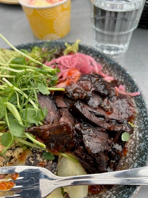 Plate with whale, greens, and potatoes