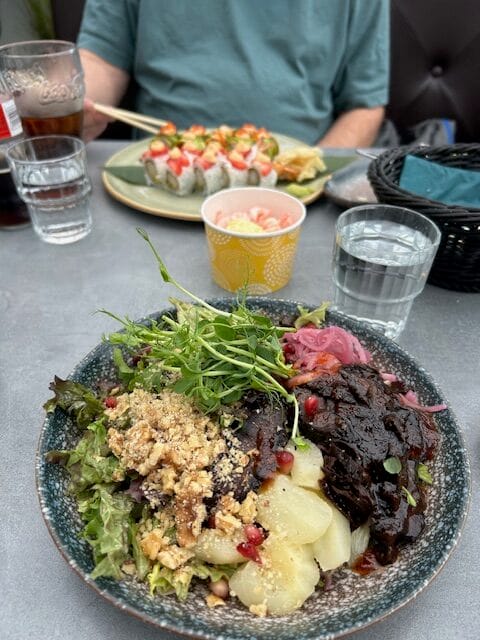 Plate of vegetables, whale, and potatoes at a restaurant in Bergen, Norway.