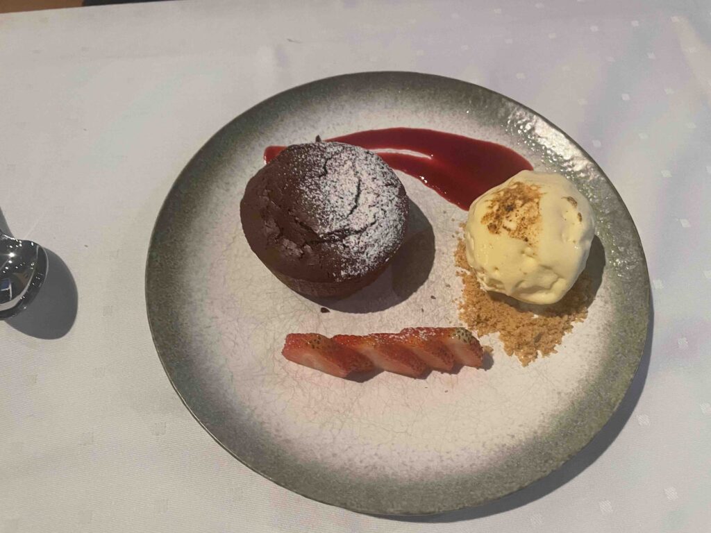 chocolate fondant with vanilla ice cream and strawberries