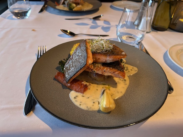 fish with skin on amadine sauce with a few vegetables