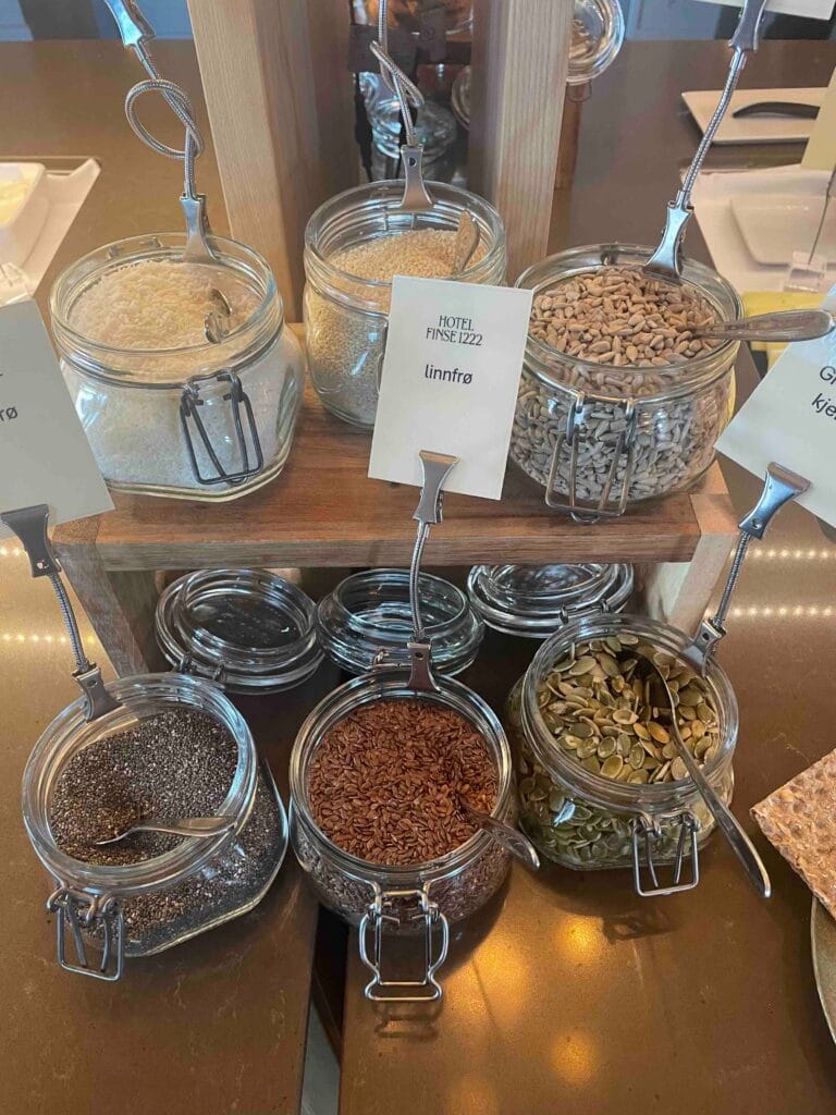Jars of nuts and seeds with Norwegian signage