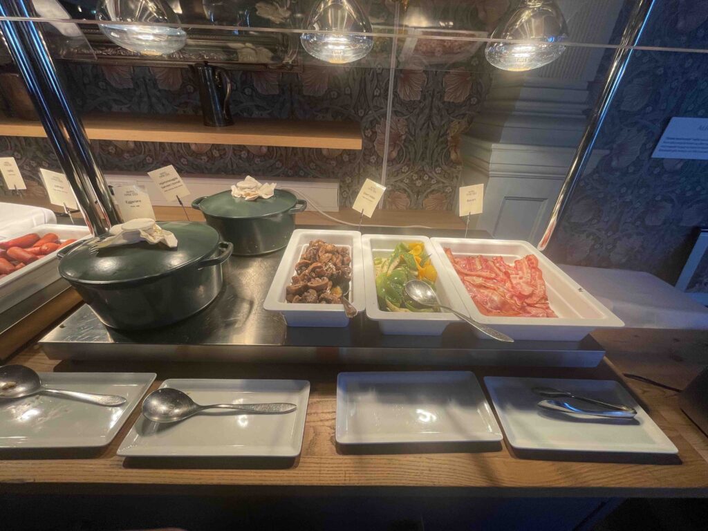 hotel breakfast with eggs, mushrooms, and vegetables