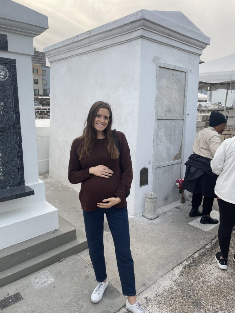 pregnant woman in front of Marie Laveau's tomb