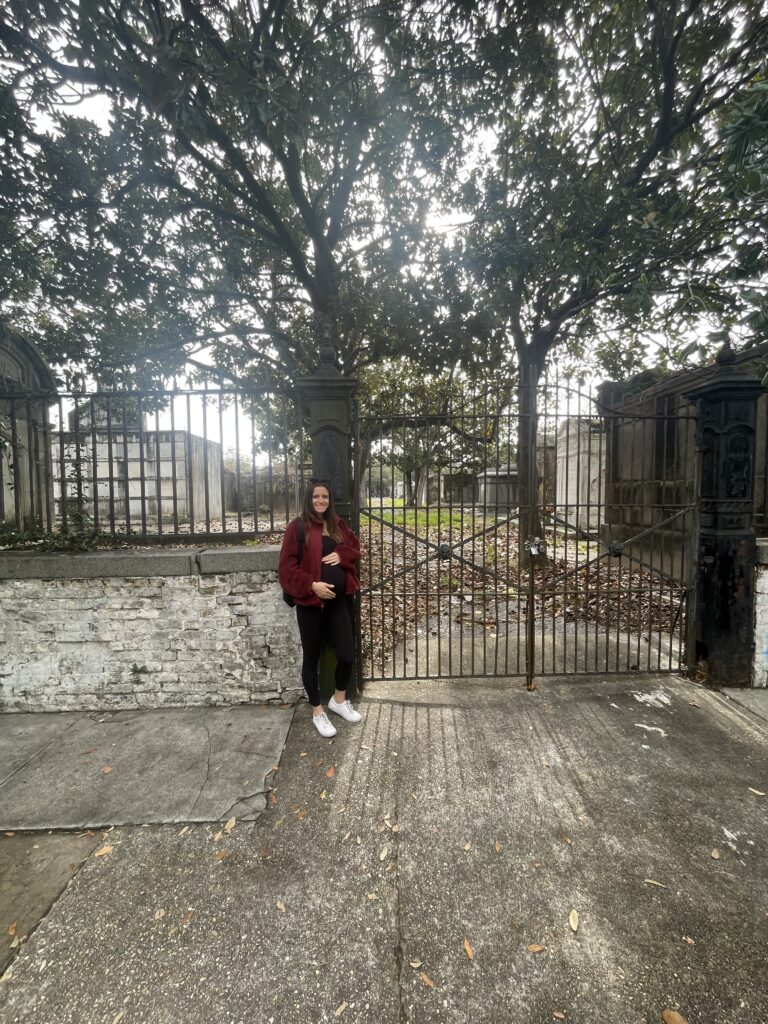 Lafayette Cemetery No. 1 with pregnant woman outside