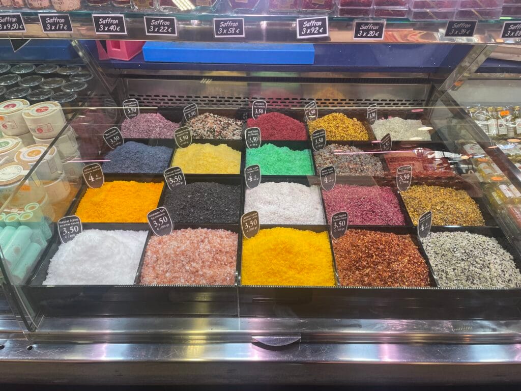 array of brightly colored spices at a Spanish market